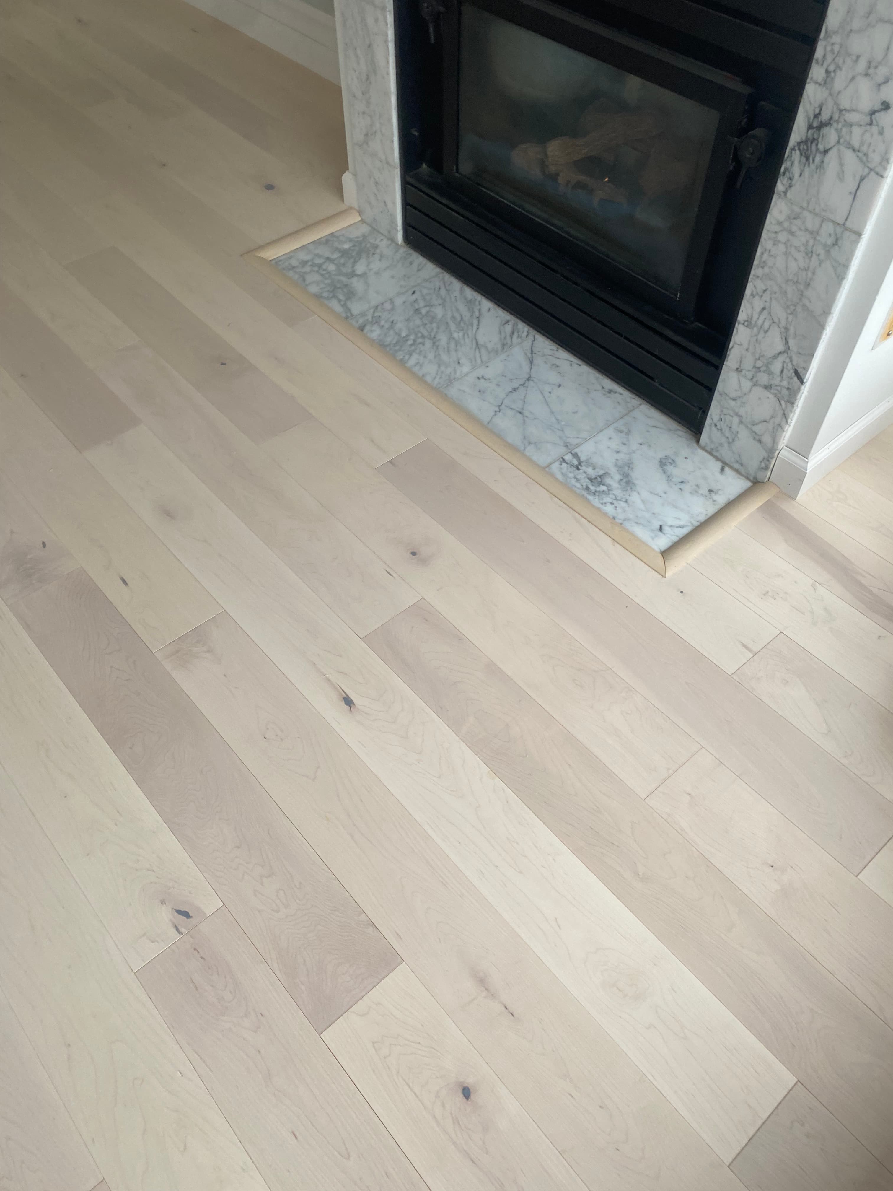 Light-stained engineered wood floor